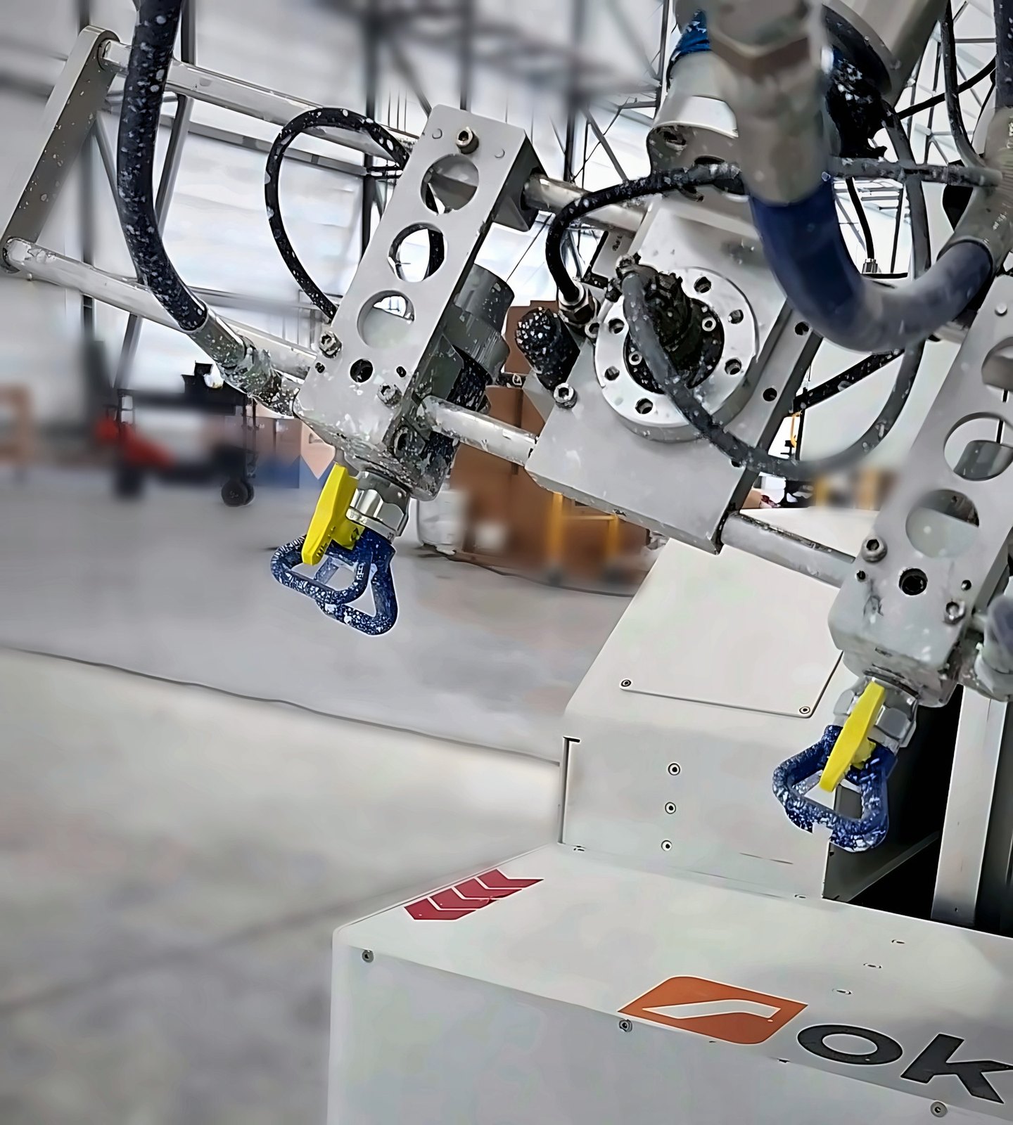The BLASTER on an Okibo EG7+: two spray guns on one bracket, firing in sync